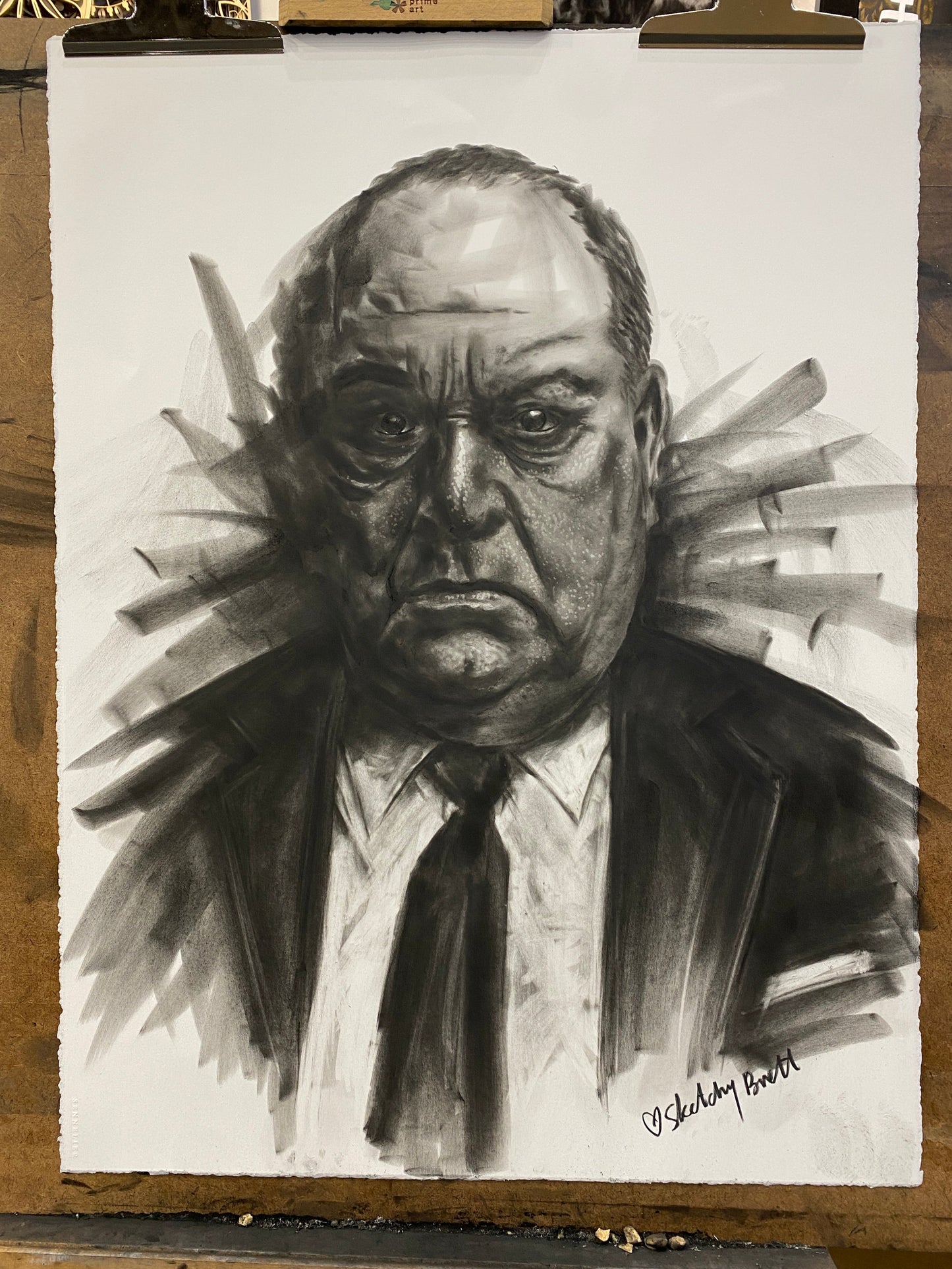 Charcoal drawing of a mob Don on a white sheet of paper.